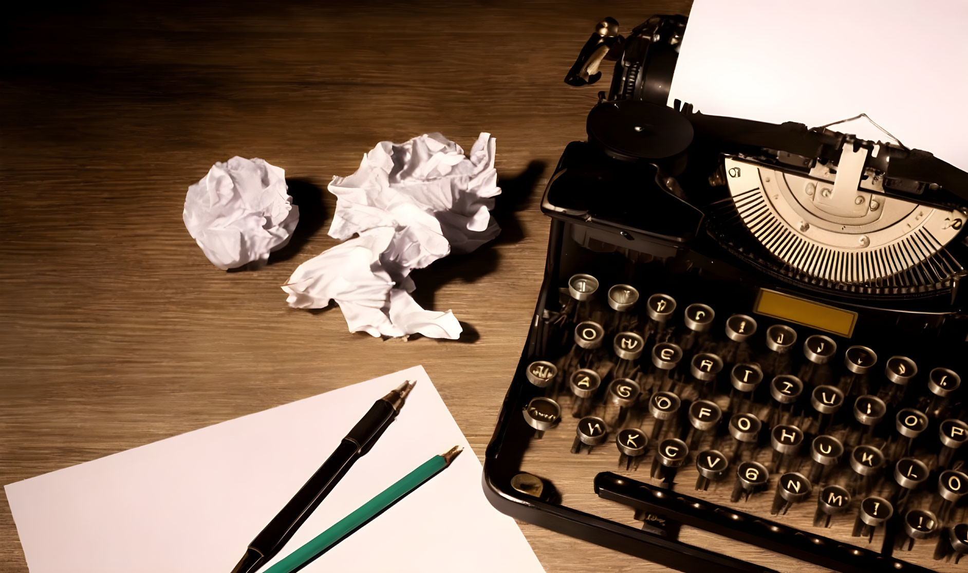 Vintage Typewriter and Writing Tools on Wooden Desk