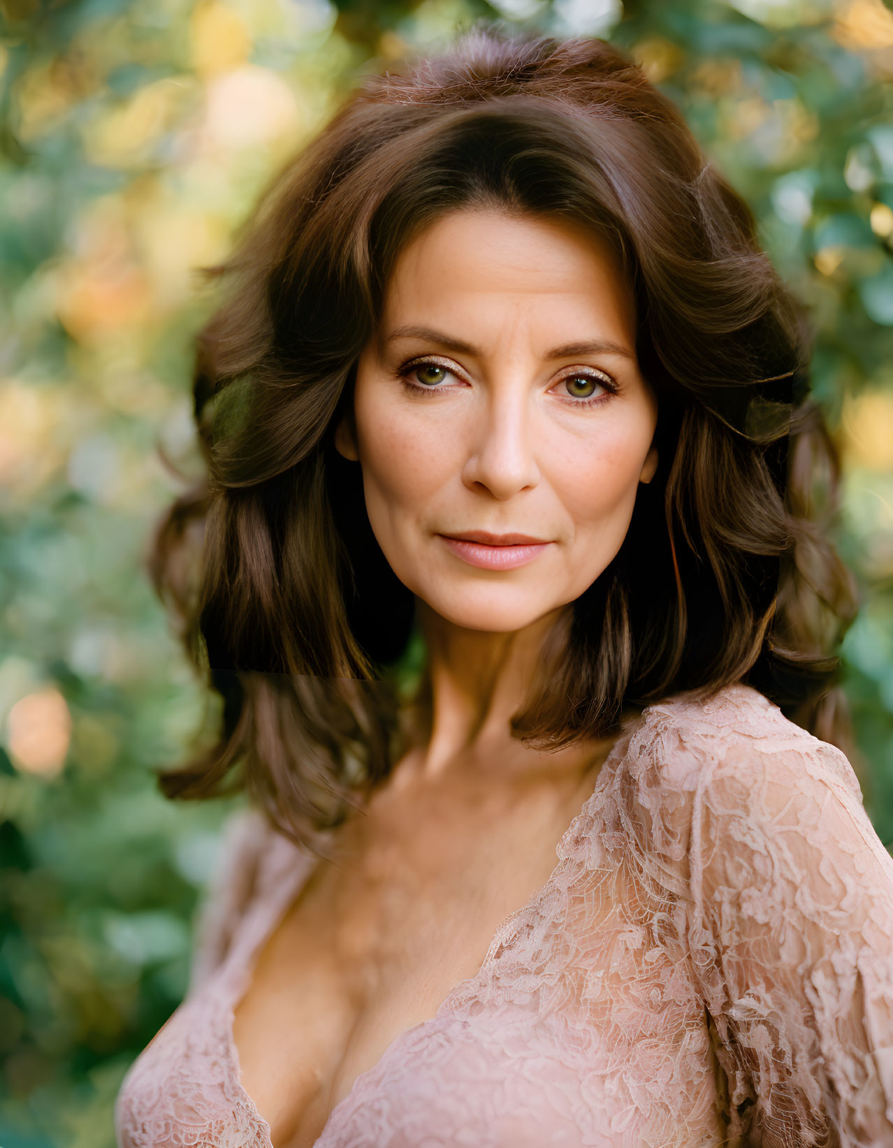 Portrait of Woman with Medium-Length Brunette Hair in Lace Dress on Blurred Green Background