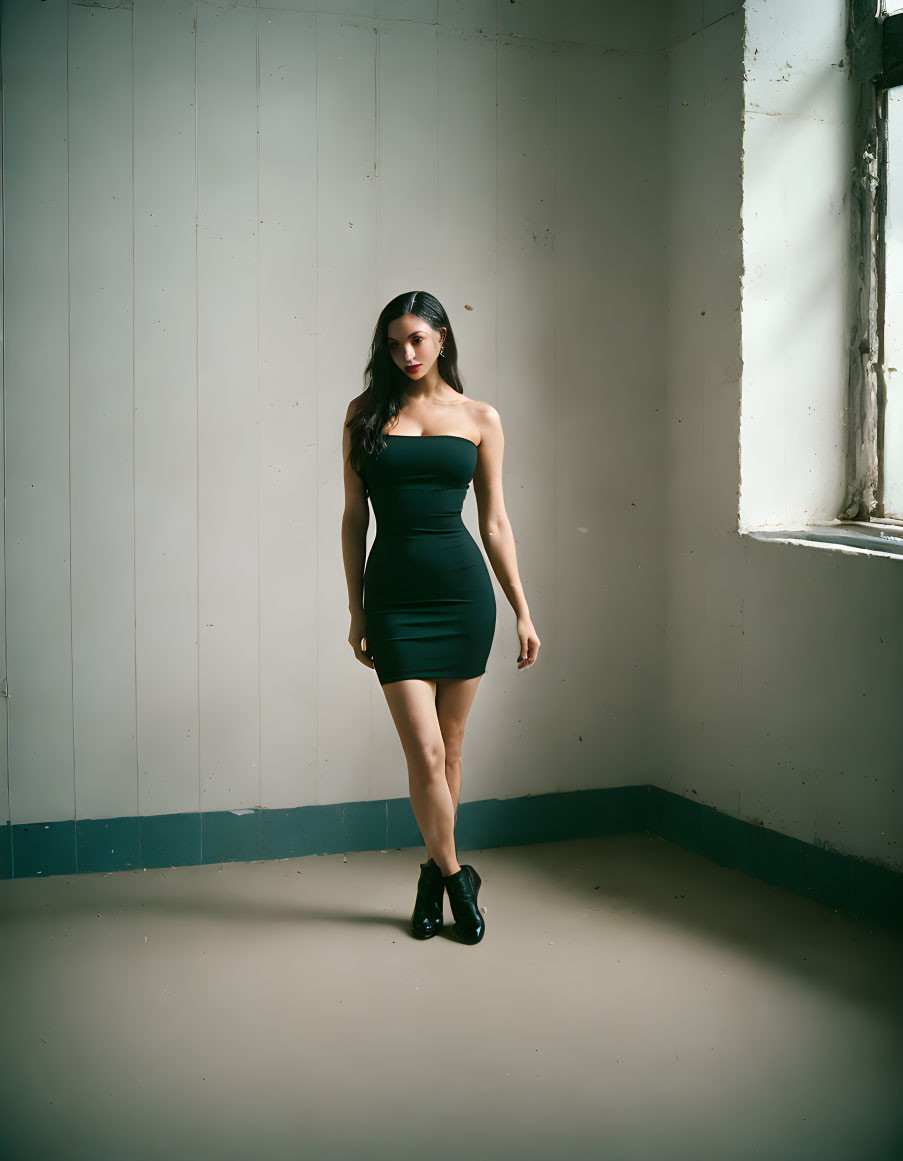 Woman in Black Strapless Dress in Sunlit Room