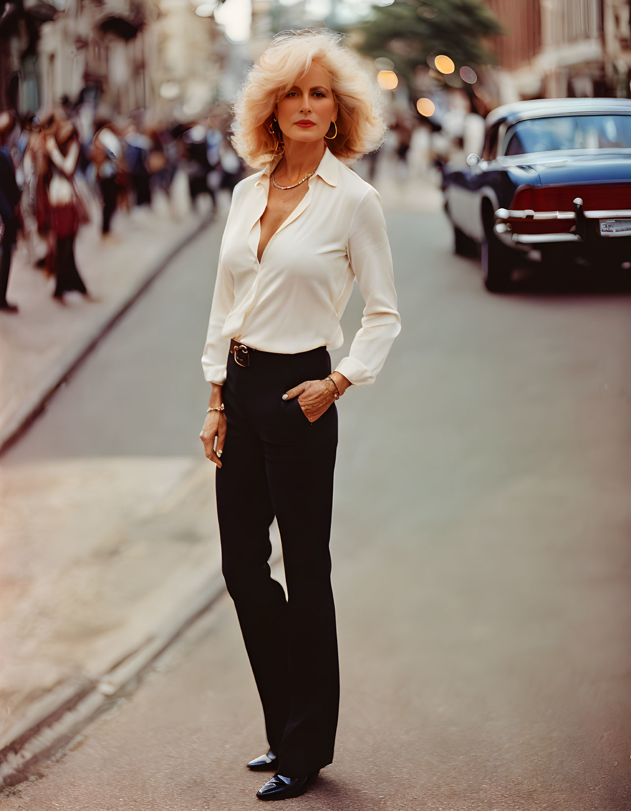 Blonde woman in white blouse and black trousers on street