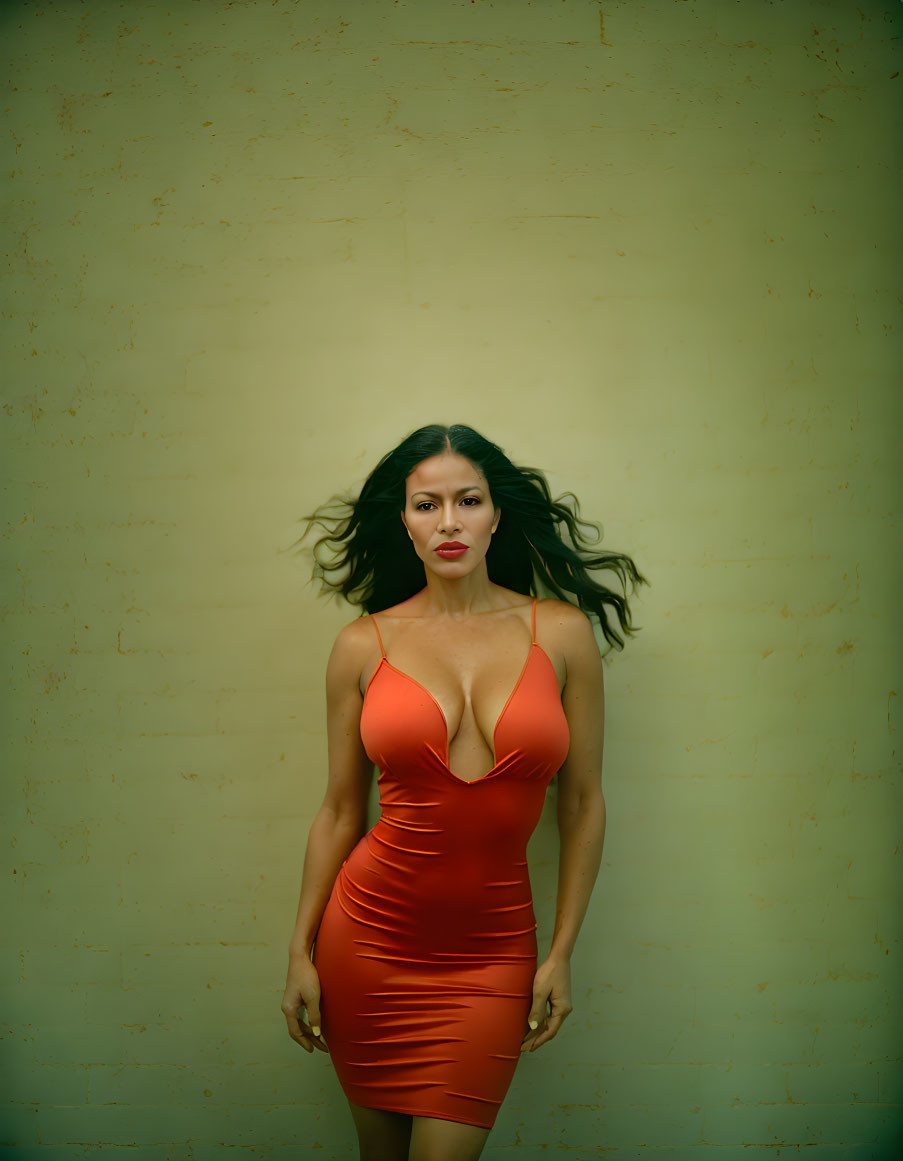 Woman in Red Dress Against Textured Beige Background