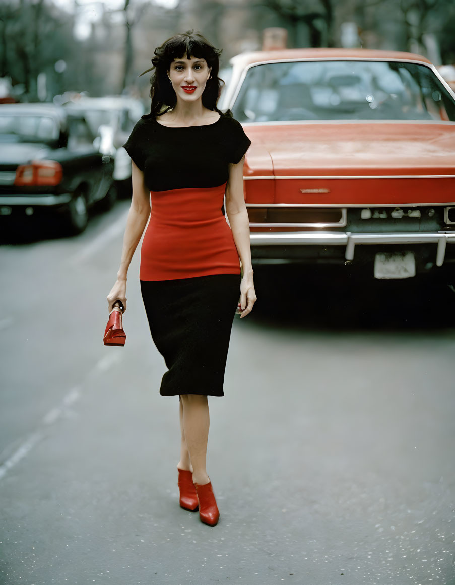 Woman in Black and Red Dress Holding Glasses by Vintage Red Car