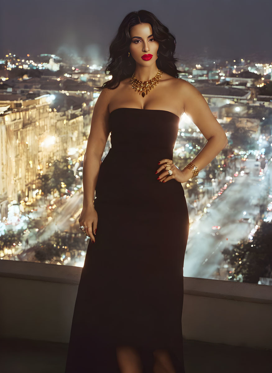 Woman in Black Strapless Gown with Red Lipstick and Gold Jewelry in Night Cityscape