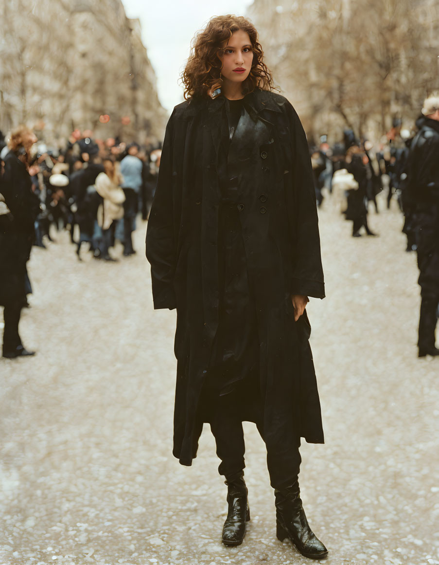 Person in Black Trench Coat Stands Out on Tree-Lined Street