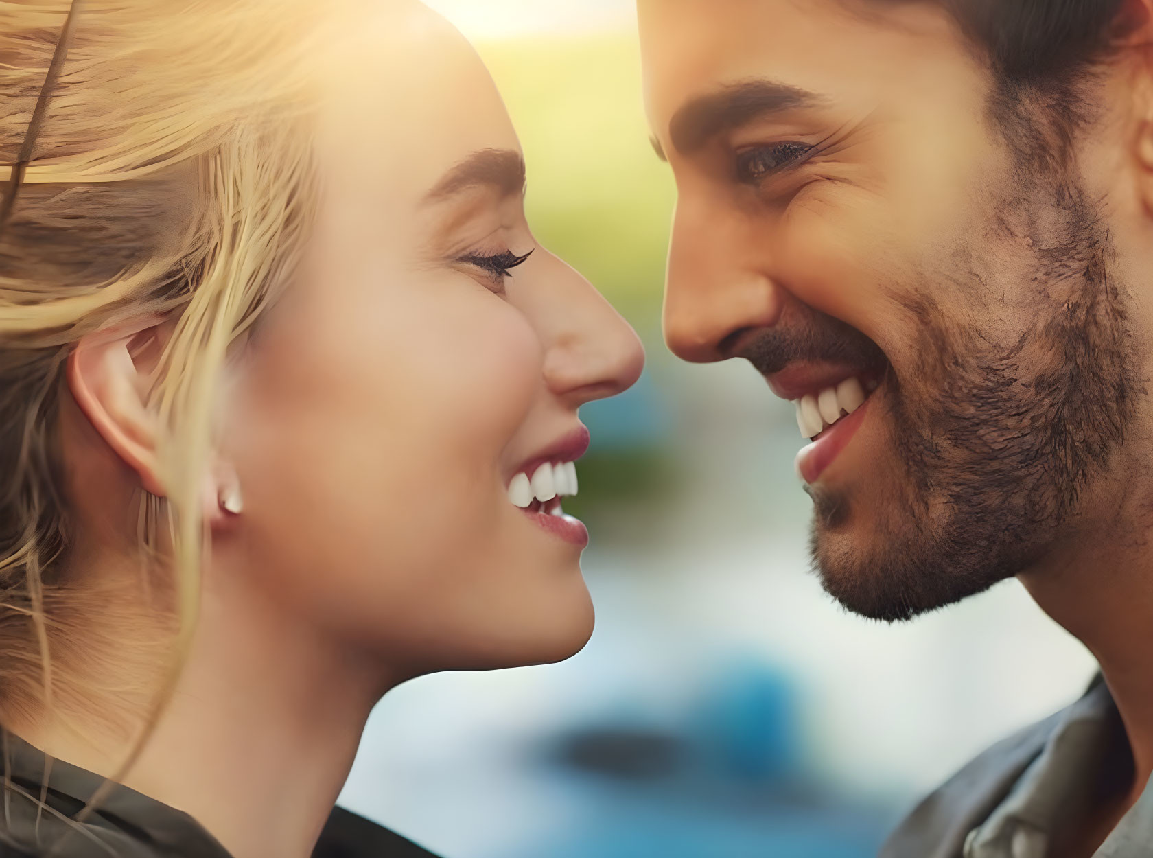 Close-Up Portrait of Smiling Man and Woman in Warm Sunlight