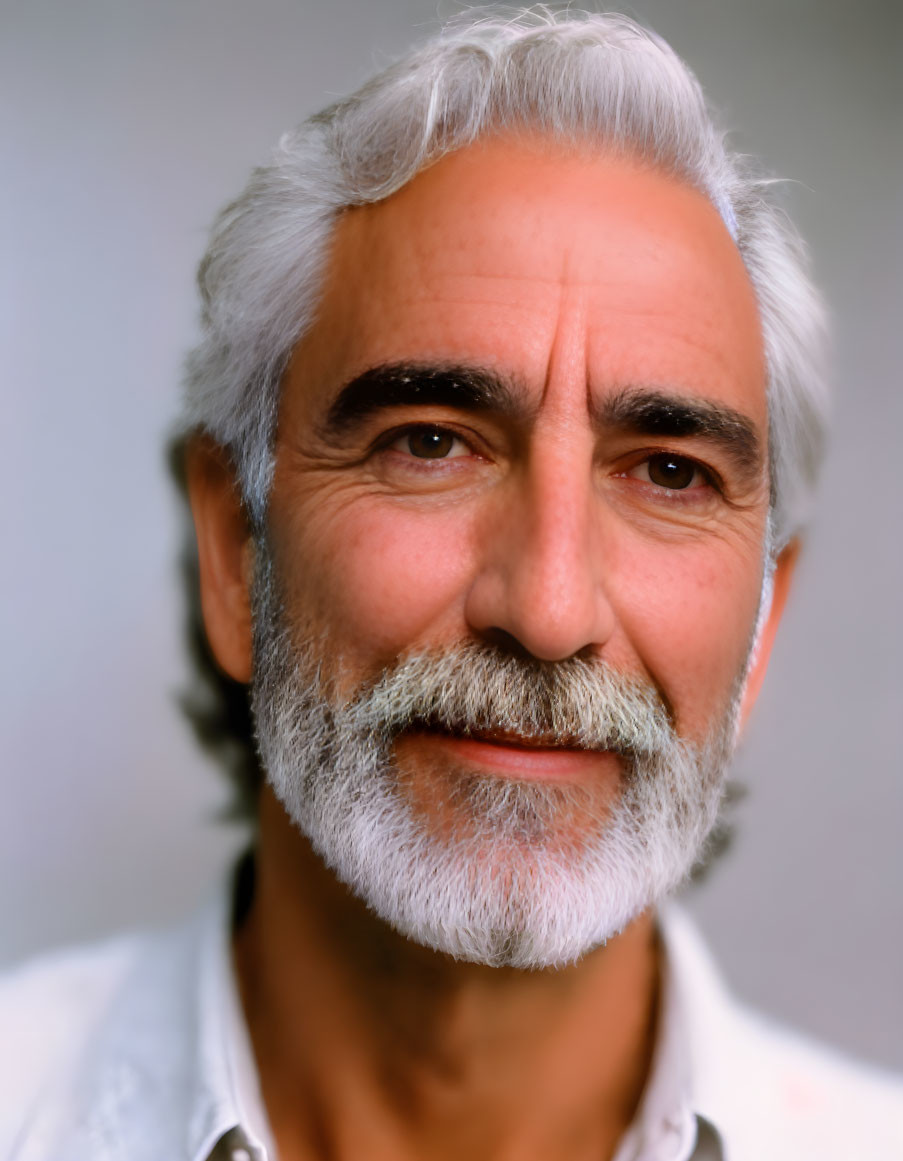 Elderly man portrait with white beard and smile