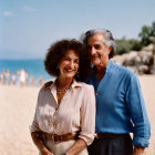 Elderly couple smiling on sunny beach with people in background