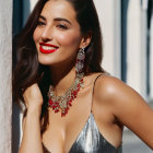 Woman in Red Lipstick and Sparkling Silver Dress with Statement Jewelry Smiling