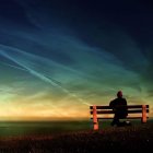 Solitary Figure on Bench by the Sea at Dusk