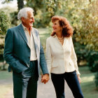 Elderly Couple Smiling Holding Hands Outdoors