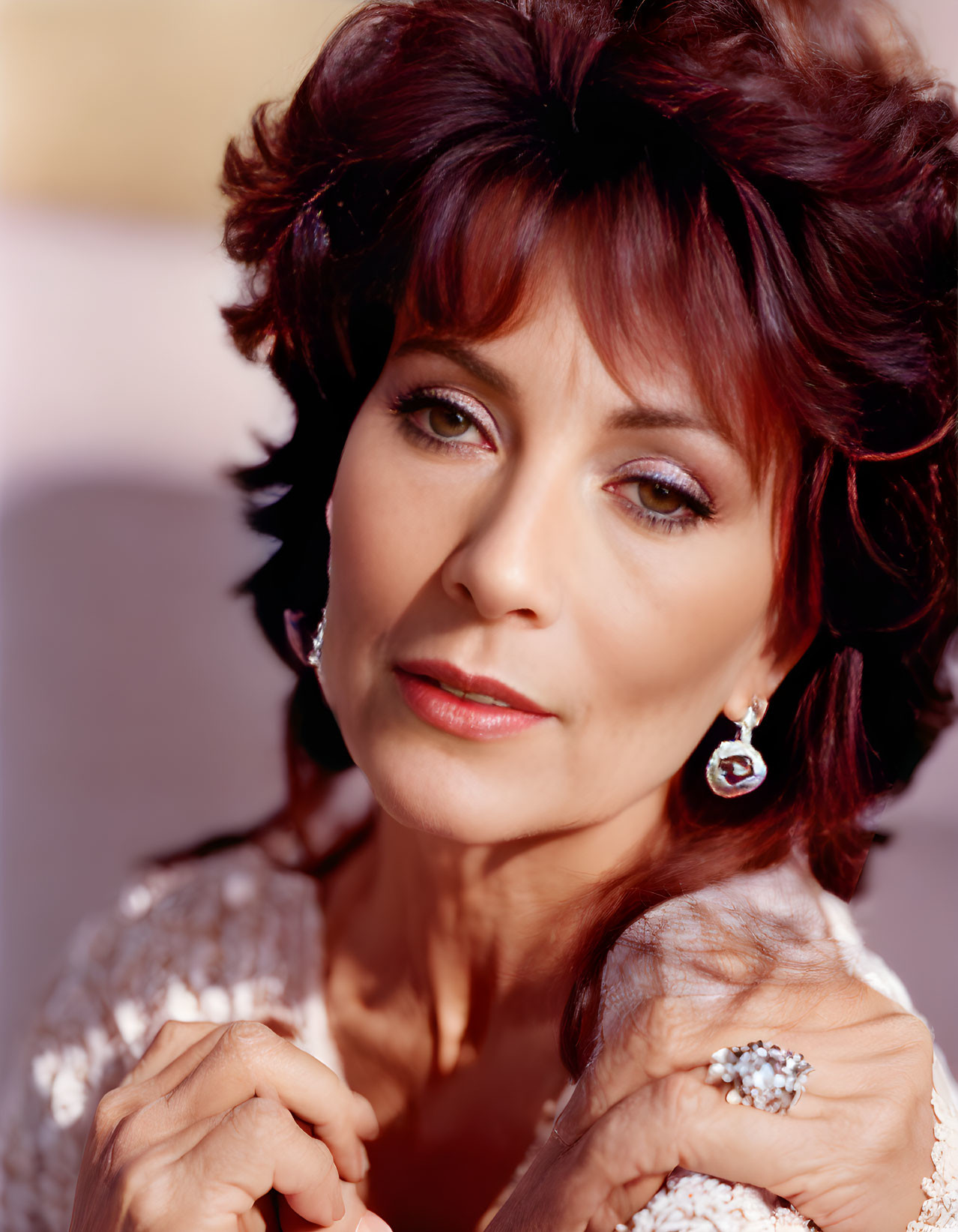 Auburn-Haired Woman in White Outfit with Jewelry