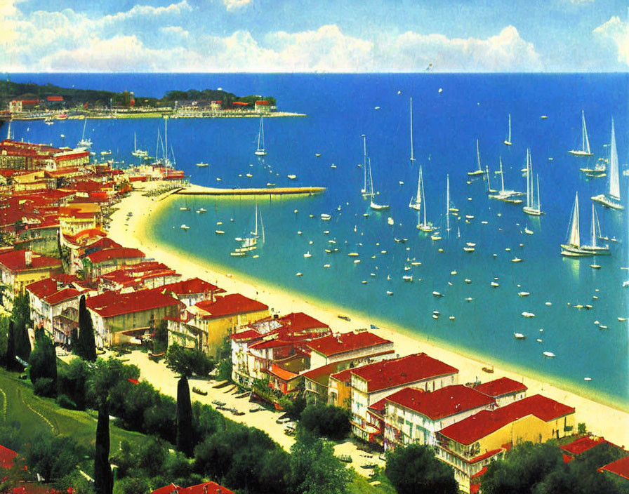 Scenic coastal town with red-roofed buildings, sandy beach, sailboats, and lush green