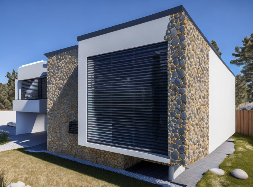 Contemporary house with stone wall accents and large windows in landscaped yard.