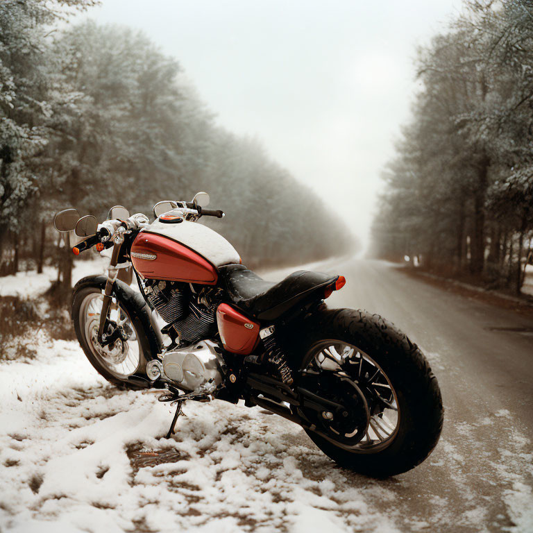 Red and Black Motorcycle on Snow-Covered Road