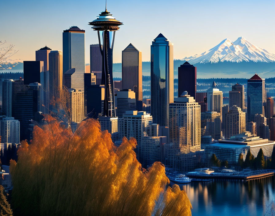 City skyline with tower, skyscrapers, waterfront, and snow-capped mountain.