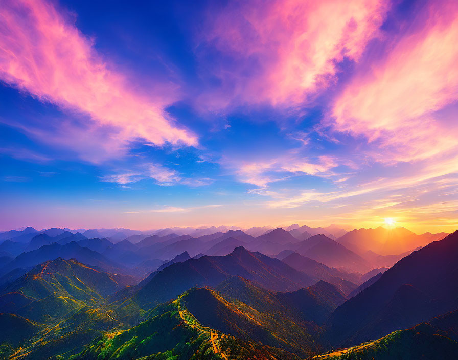 Majestic mountain range at sunrise with pink and blue sky