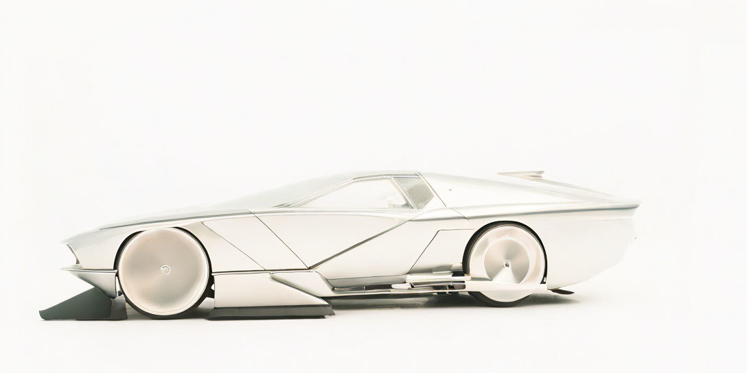 Sleek white concept car with geometric design and covered rear wheel