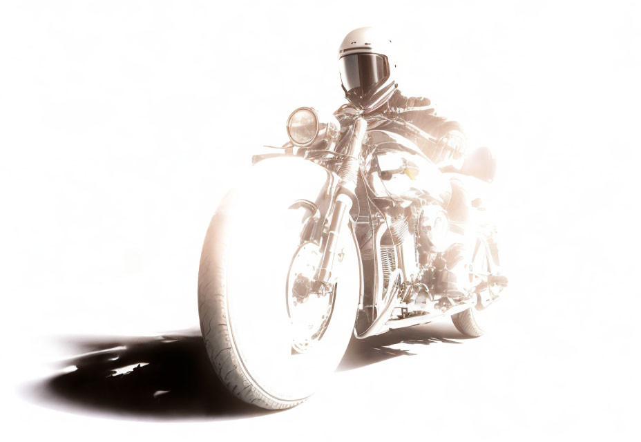 Bright high-key photo: biker in gear on chrome motorcycle with dramatic lighting