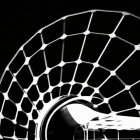 Modern honeycomb design structure in monochrome against dark backdrop.