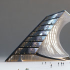 Wave-shaped glass building under dramatic sky with tiny figures showcasing grand scale