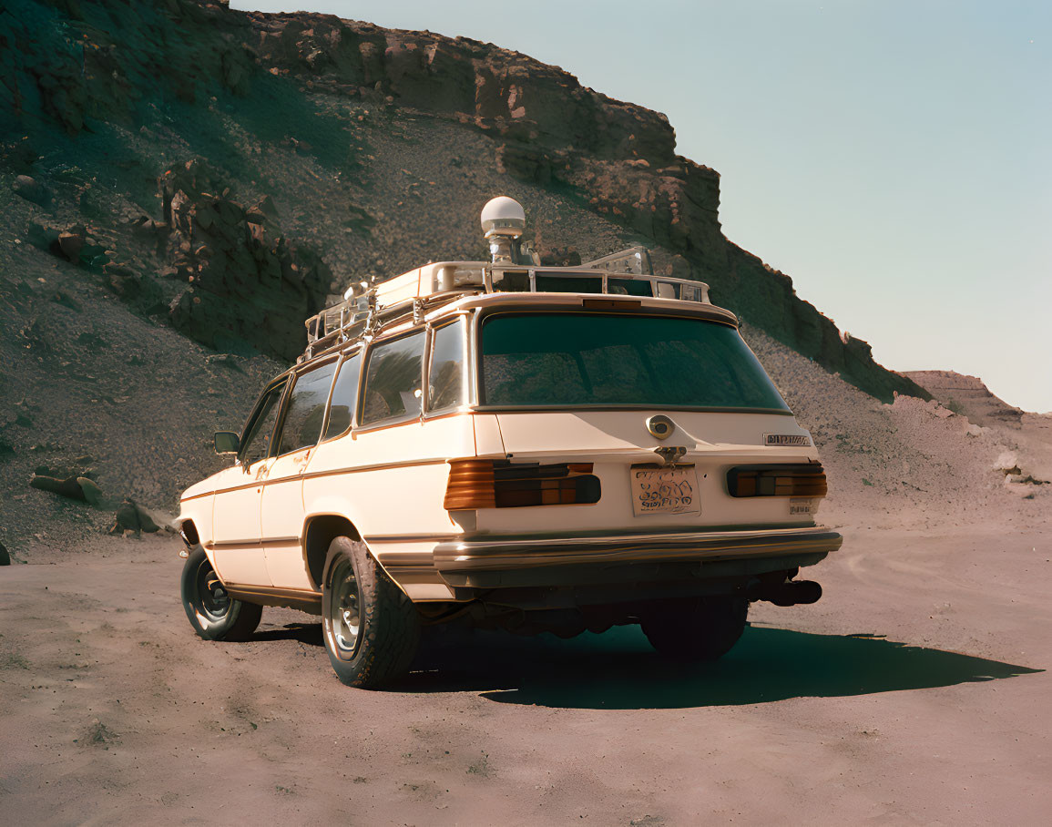 Classic Station Wagon with Roof Rack and Sensing Equipment in Desert Setting