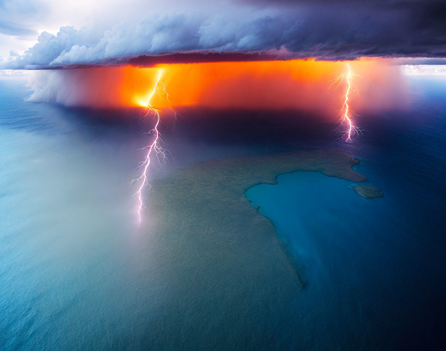 Vibrant lightning bolts in dramatic storm over ocean