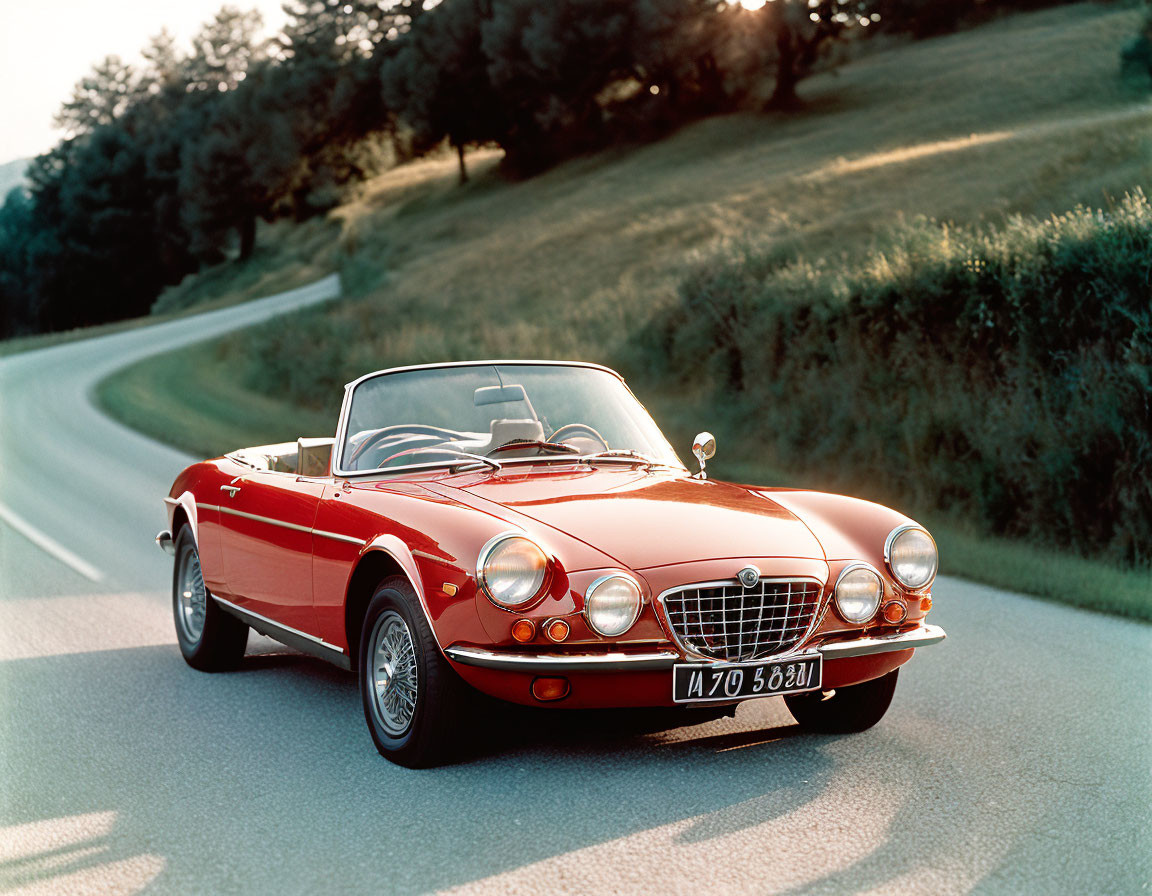 Classic Red Convertible Car Parked in Greenery at Golden Hour