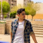 Urban setting: Stylish person with mohawk, futuristic leather jacket, sunglasses, and earphones