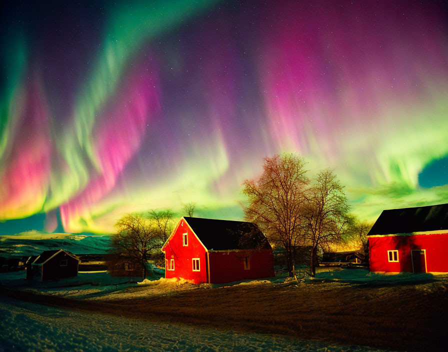 Colorful Aurora Borealis Over Red Houses and Snowy Landscape