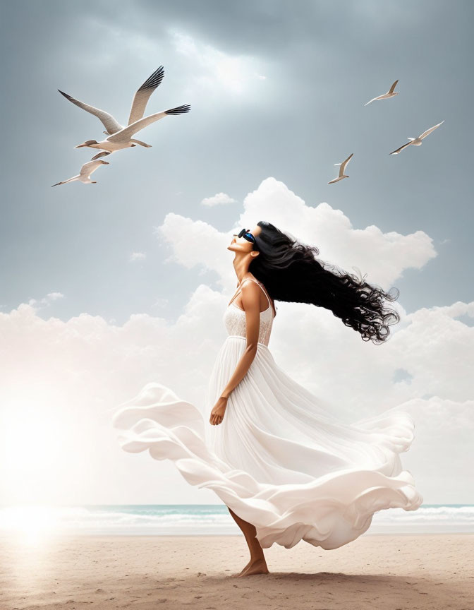 Woman in flowing white dress on beach with billowing hair and seagulls in cloudy sky