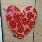 Colorful Heart-Shaped Flower Arrangement on Blue Background