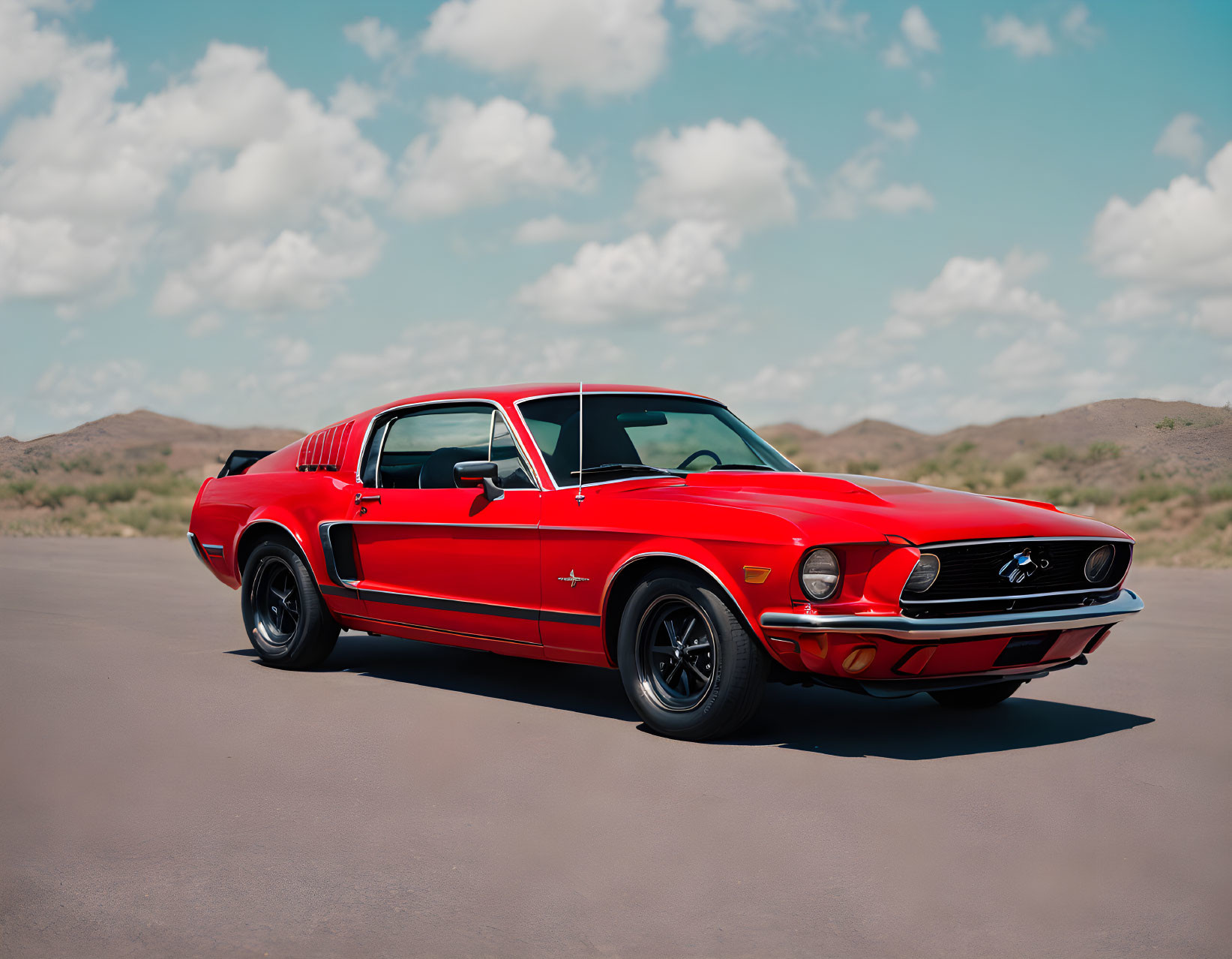 Vintage Red Mustang Parked on Empty Road with Mountainous Landscape