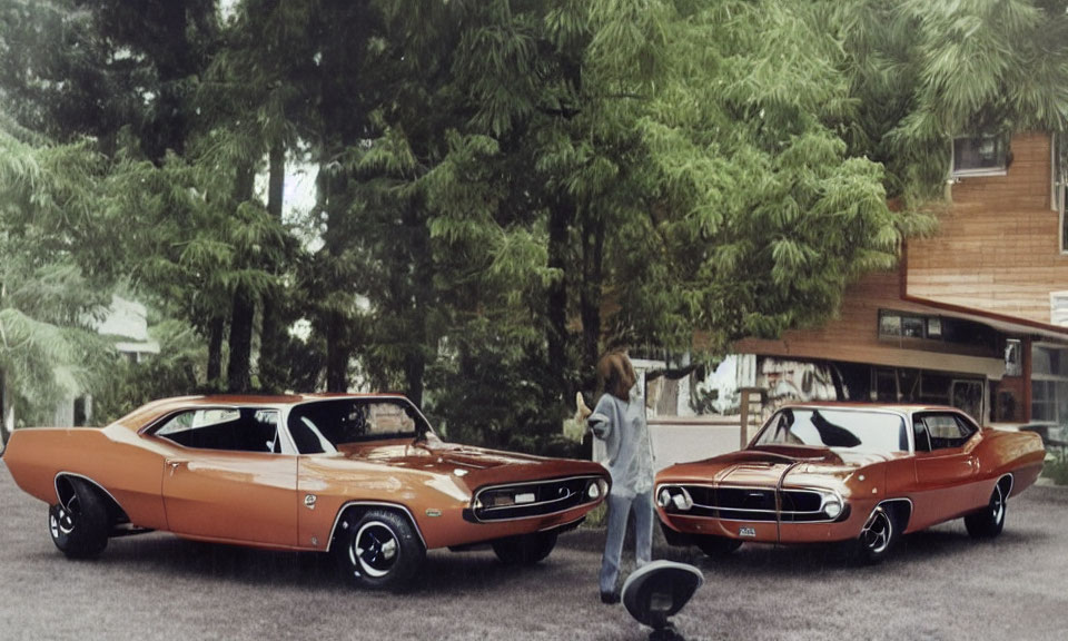 Vintage cars and retro fashion in front of suburban home.