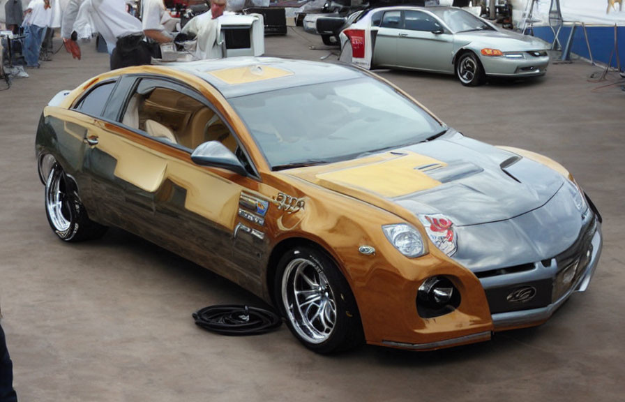 Glossy Gold and Black Custom Car with Large Wheels and Body Modifications