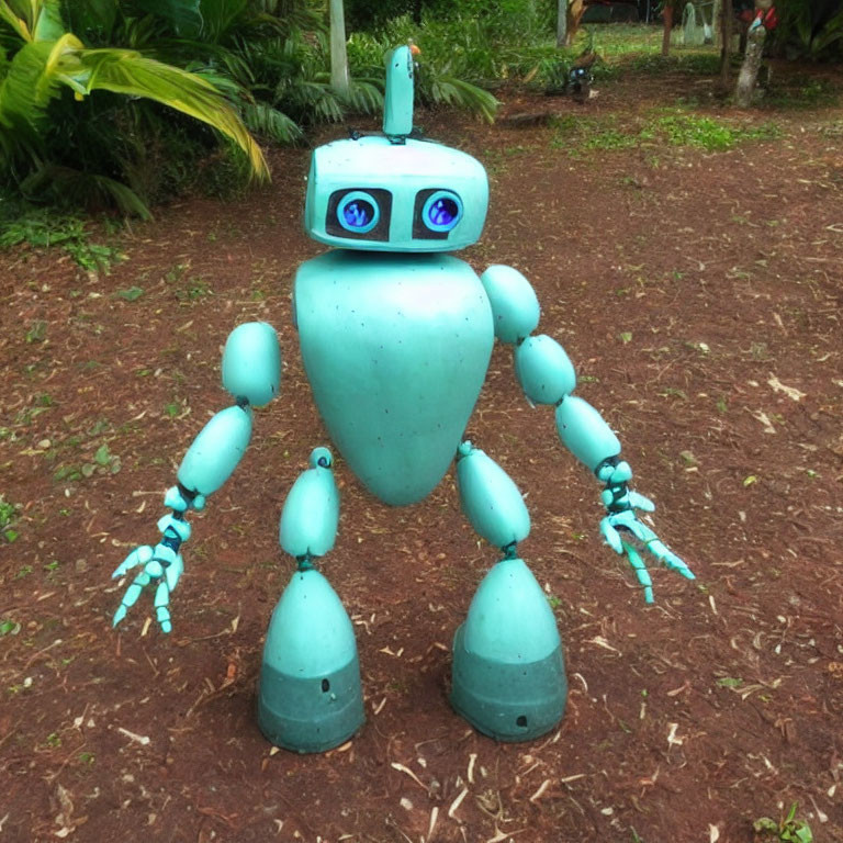 Turquoise humanoid robot sculpture with large eyes and articulated limbs in garden setting