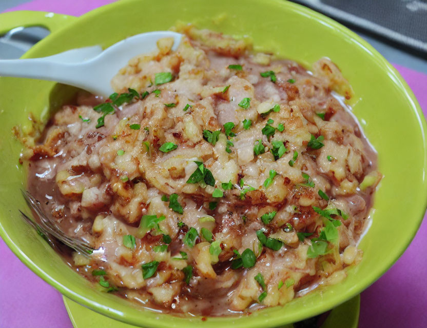 Savory Stewed Dish with Green Herbs and Textured Mix