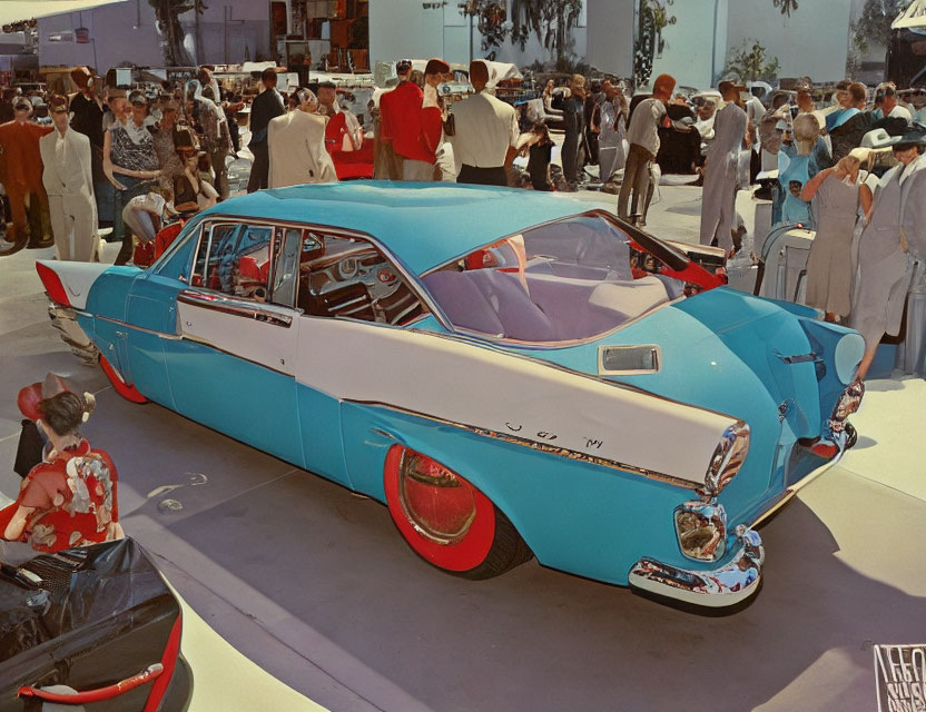 Vintage Blue Concept Car with White Roof and Red Accents at Outdoor Event