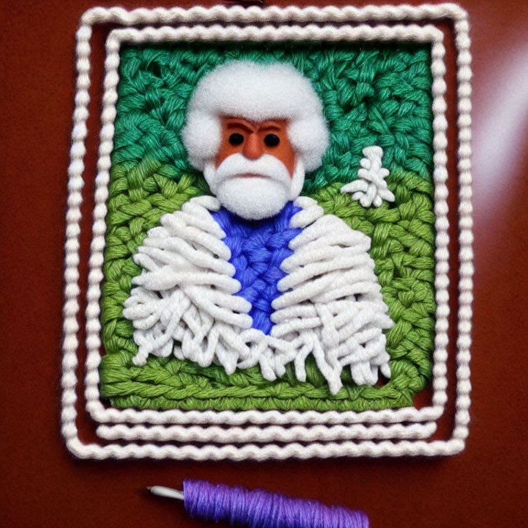 Textured craft portrait of character with white beard and blue outfit on green background.