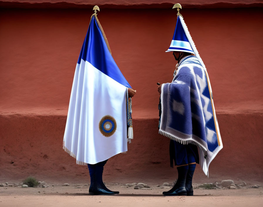 Uniformed guards in blue and white attire by red wall