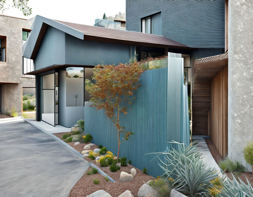 Contemporary Blue Siding House with Large Windows and Landscaped Garden