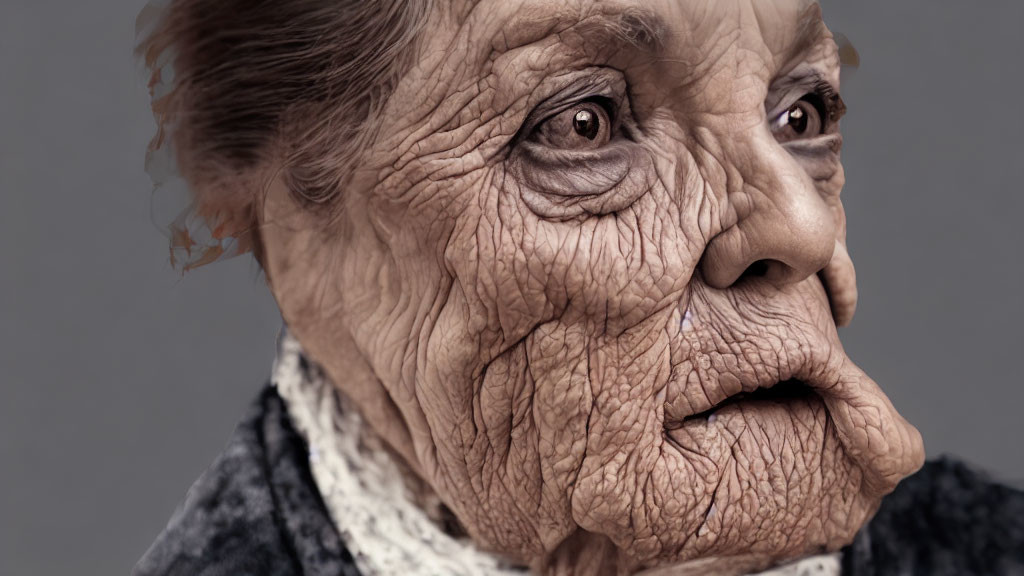 Elderly woman with deep wrinkles and aged skin on neutral background