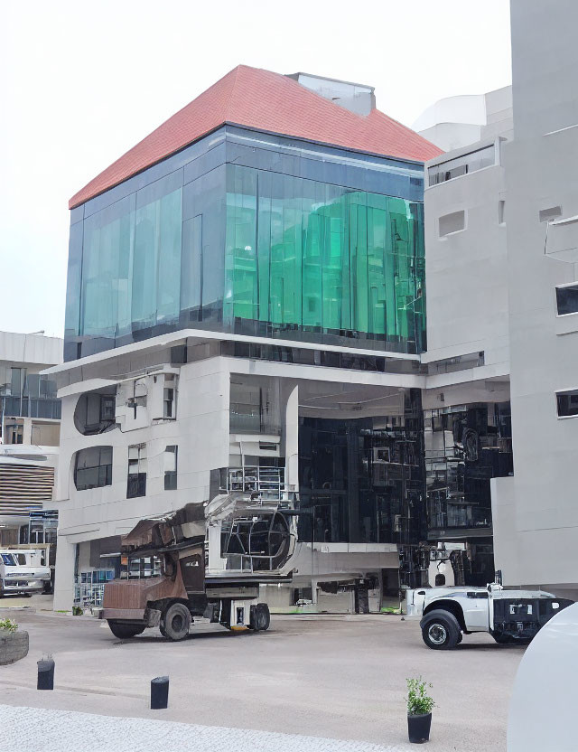 Modern Building with Blue and Green Glass Façade and Metal Structures