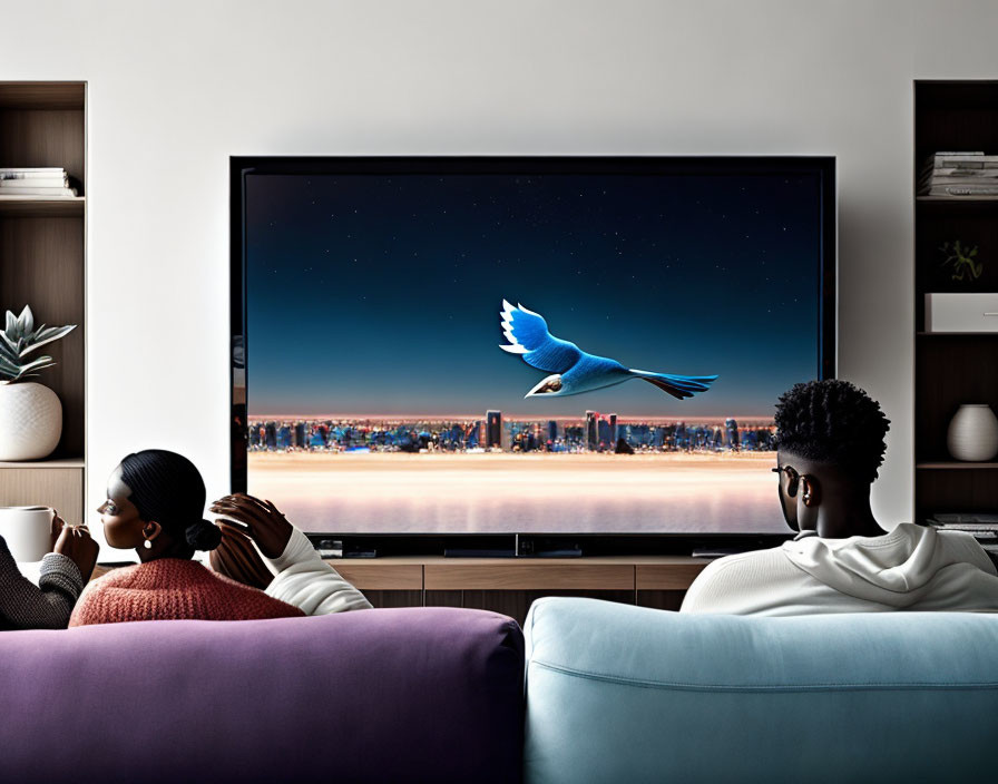 Two individuals on a couch watching a blue bird over a city on TV