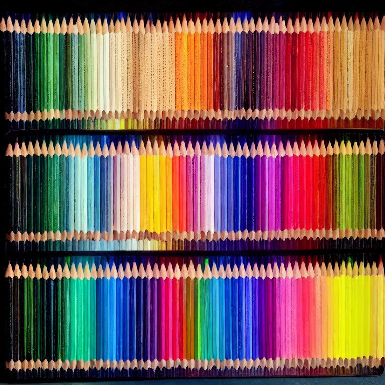 Colored pencils gradient spectrum on dark background