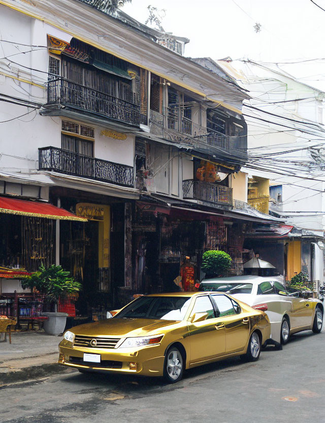 Gold Car Parked on Street with Quaint Two-Story Buildings