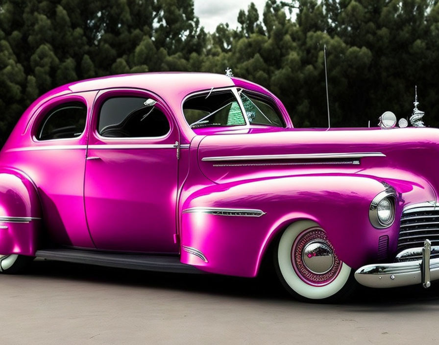 Vintage Purple Car with White-Walled Tires and Chrome Detailing in Outdoor Setting