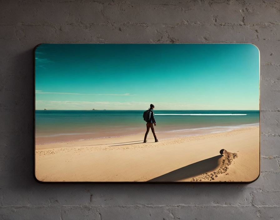 Person walking on sandy beach with calm sea and clear skies - Wall-mounted image