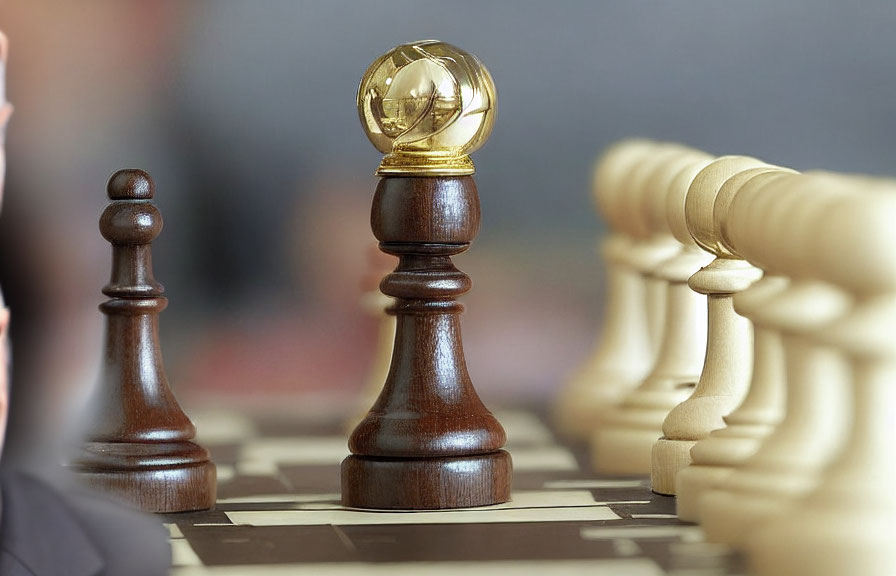 Crystal Globe on Dark Queen Chess Piece on Checkered Board