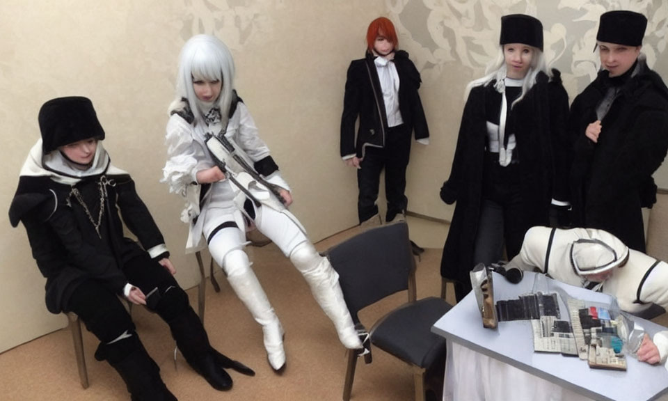 Group of Five Cosplayers in Futuristic Black and White Costumes with Electronic Parts