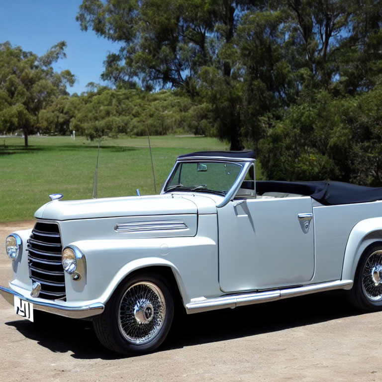 Classic White Convertible Car with Spoke Wheels and Chrome Grille